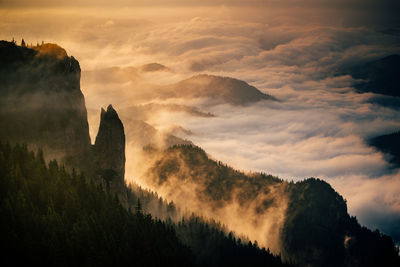 Scenic view of silhouette mountains against sky during sunset