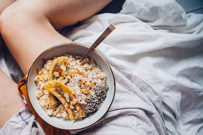 Close-up of woman having breakfast in bed