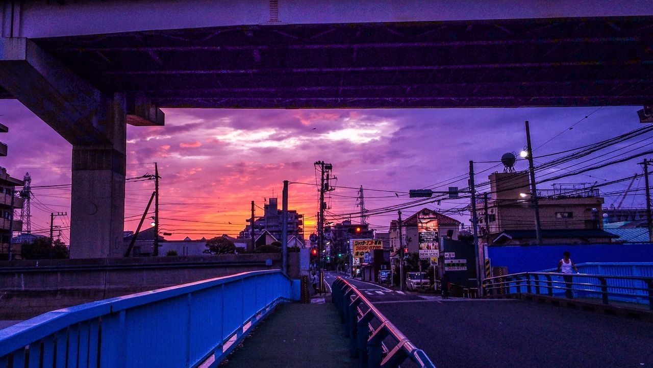 architecture, built structure, building exterior, sky, transportation, city, cloud - sky, the way forward, connection, street light, dusk, bridge - man made structure, cloud, street, illuminated, sunset, diminishing perspective, outdoors, water, railing