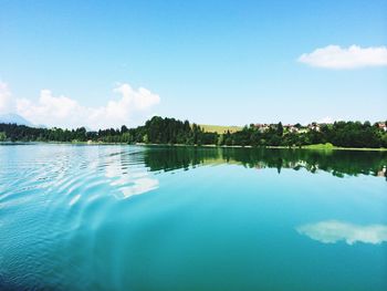 Reflection of clouds in calm lake