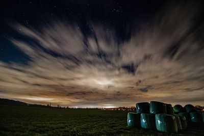 Scenic view of field against sky at night