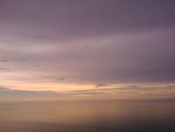 Scenic view of sea against sky at sunset