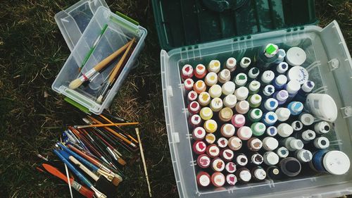 Aerial view of plastic container with paints