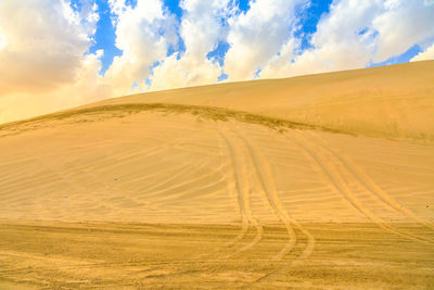 Scenic view of desert against sky