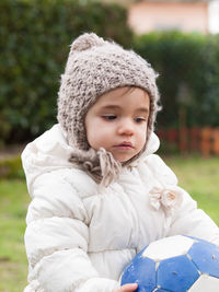 Portrait of cute girl in park during winter