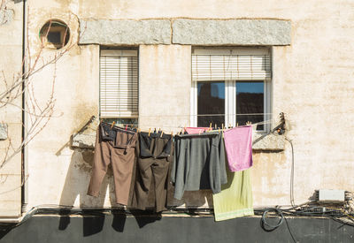 Low section of woman standing in abandoned house