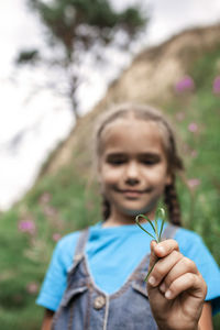 Portrait of girl holding flower