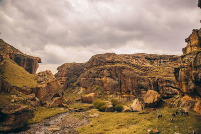 Panoramic view of rocky mountains against sky