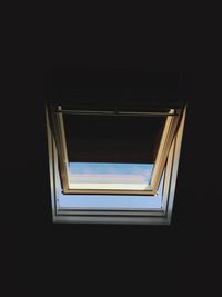 Close-up of illuminated lamp against black background