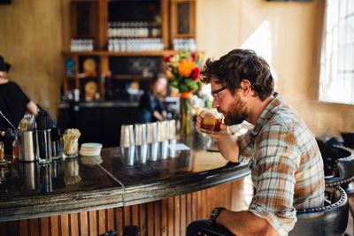 Man having cocktail in bar