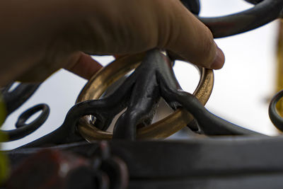 Close-up of hand holding metal of schöner brunnen