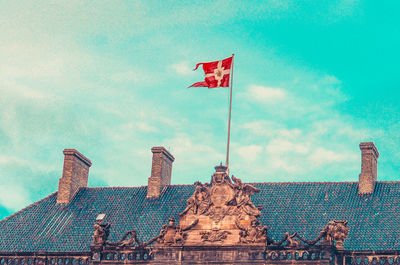 Low angle view of flag against sky