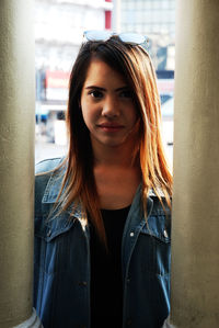 Close-up portrait of young woman standing outdoors