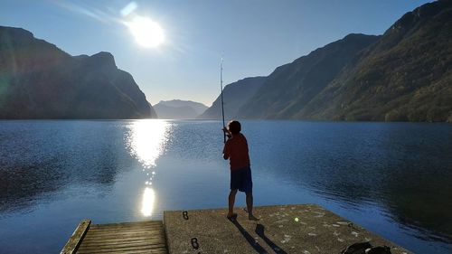 Young boy fishing at frafjord / norway