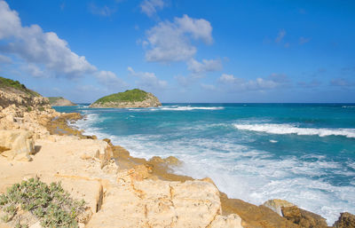 Scenic view of sea against blue sky