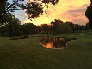 Scenic view of lake against sky during sunset