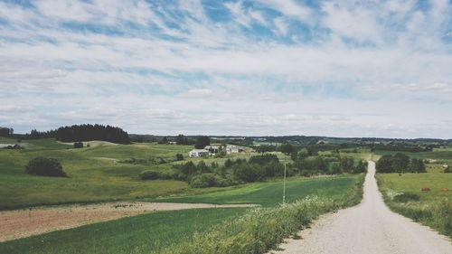 Road passing through field