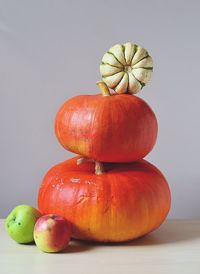 Close-up of apple on table against white background