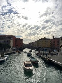 Boats moored in sea against sky