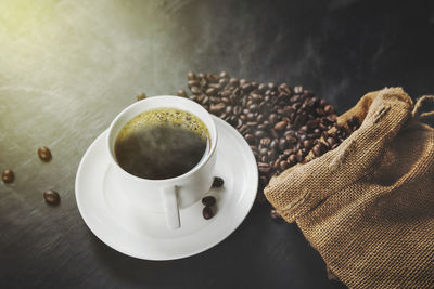 High angle view of coffee cup on table