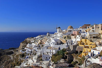 The beautiful village of oia on santorini with the typical greek white houses