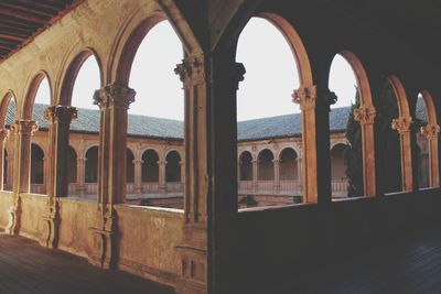 Historic building seen through arch window