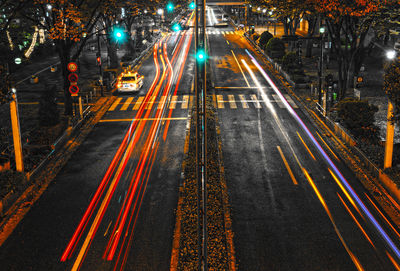 High angle view of light trails on city street at night