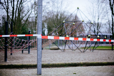 Cordon tape on pole at playground