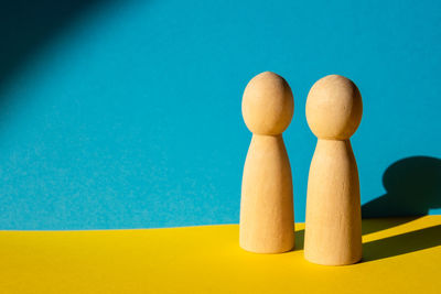 Close-up of chess pieces against blue background