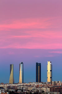 View of built structures against sunset