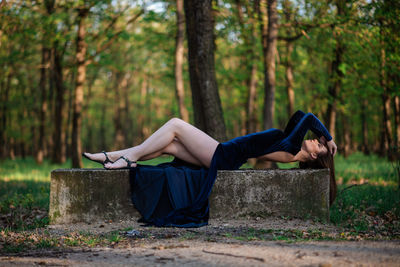 Woman sitting in a forest