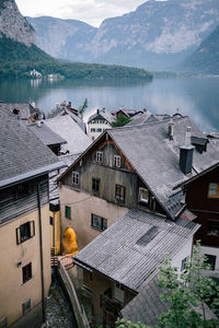 Houses by lake and mountains