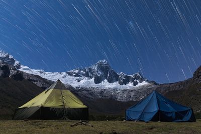 Scenic view of tent against sky at night