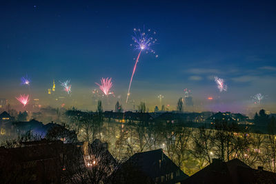 Firework display in sky at night