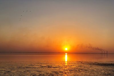 Scenic view of sea against sky during sunset