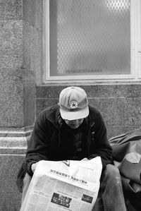 Portrait of a man sitting on paper