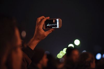 Man photographing through smart phone