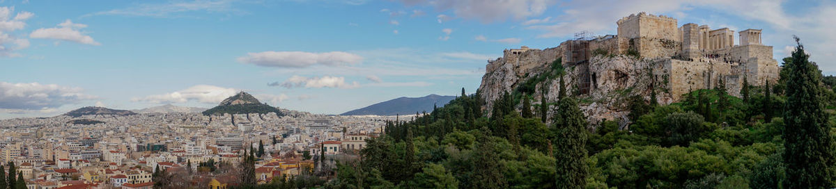 Panoramic view of castle against cloudy sky