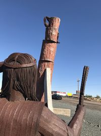 Old sculpture against clear sky