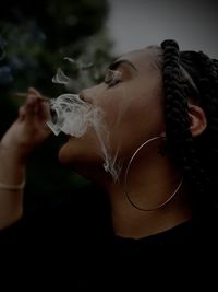 Brown girl smoking a blunt