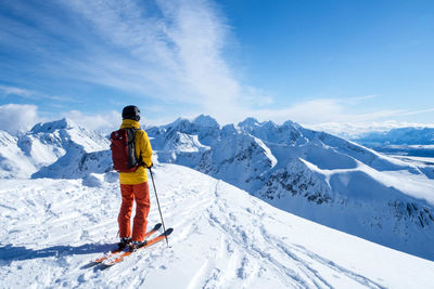 People walking on snow covered mountain