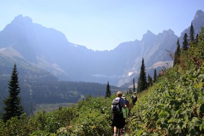 Rear view of man standing on mountain