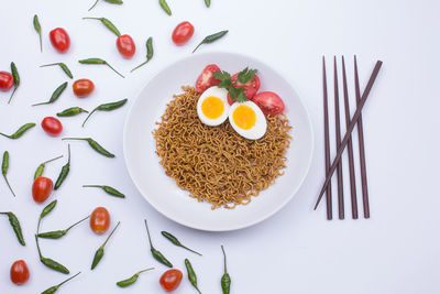 High angle view of breakfast served on white background