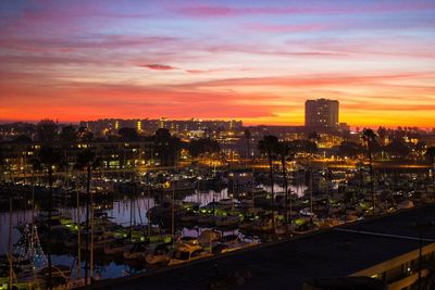 Boats at harbor in marina del rey against sky