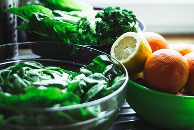 Close-up of vegetables in bowls on table