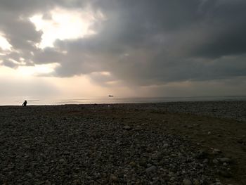 Scenic view of beach against sky during sunset