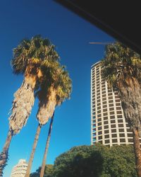 Low angle view of building against clear blue sky