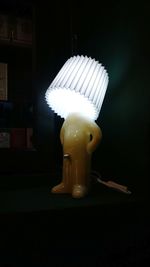 Close-up of lamp against black background