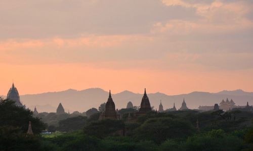 Panoramic view of temple against sky during sunset
