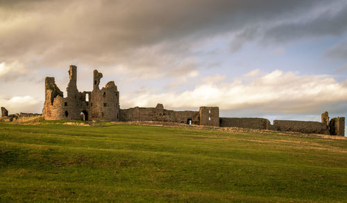 Dunstanburgh castle was built around 1313. placed on the coast of northumberland in northern england